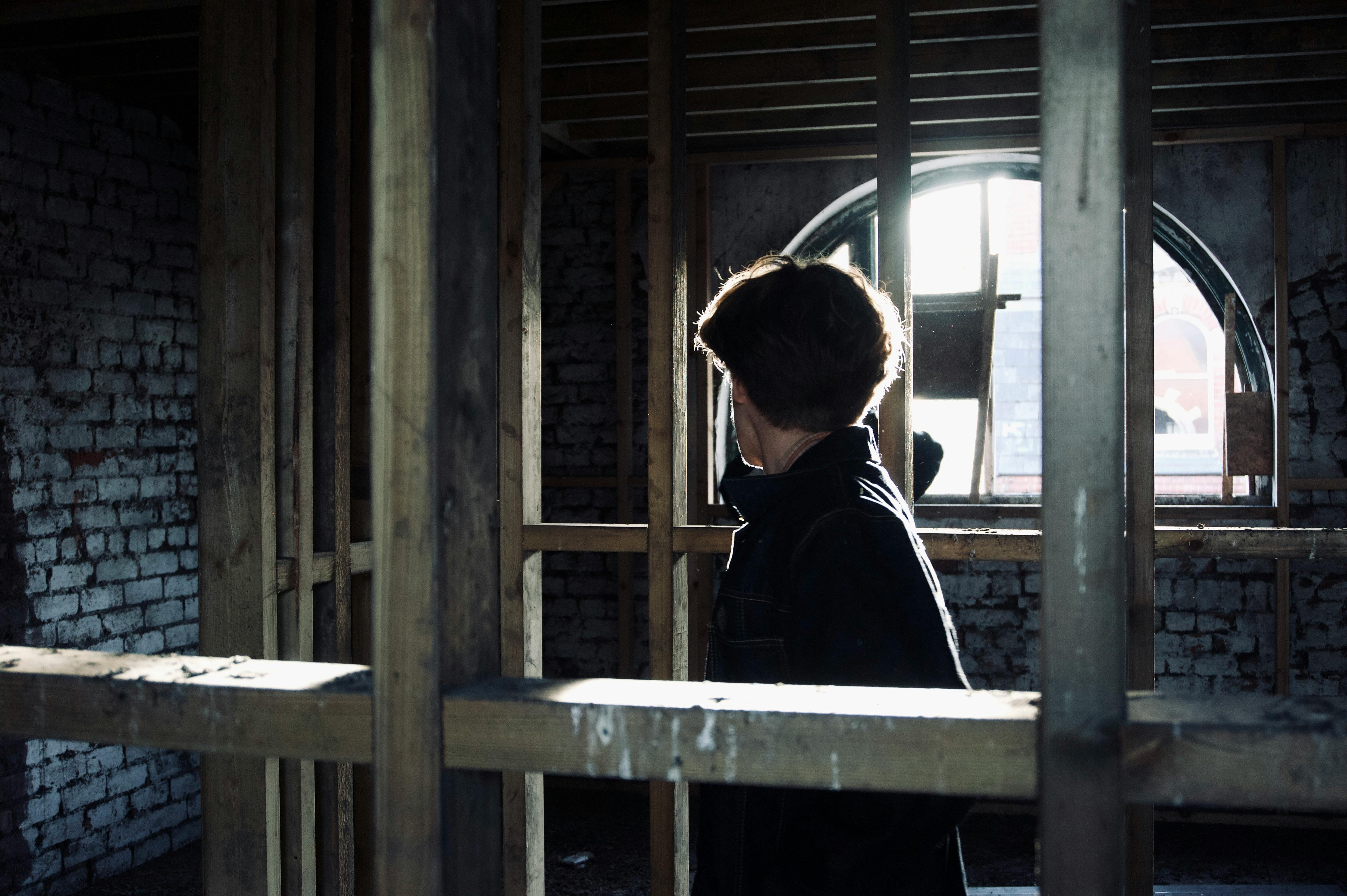 Professional business environment - person contemplating in industrial setting
